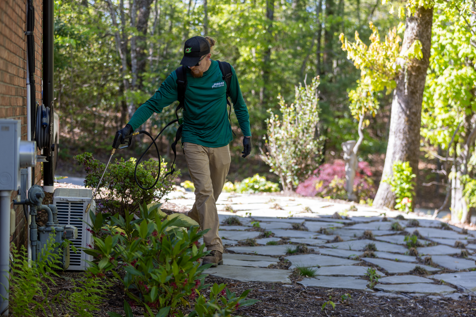 michal-robak-GIM2zTmpab8-unsplash Pisgah Pest Control technician treating a home in Asheville, NC